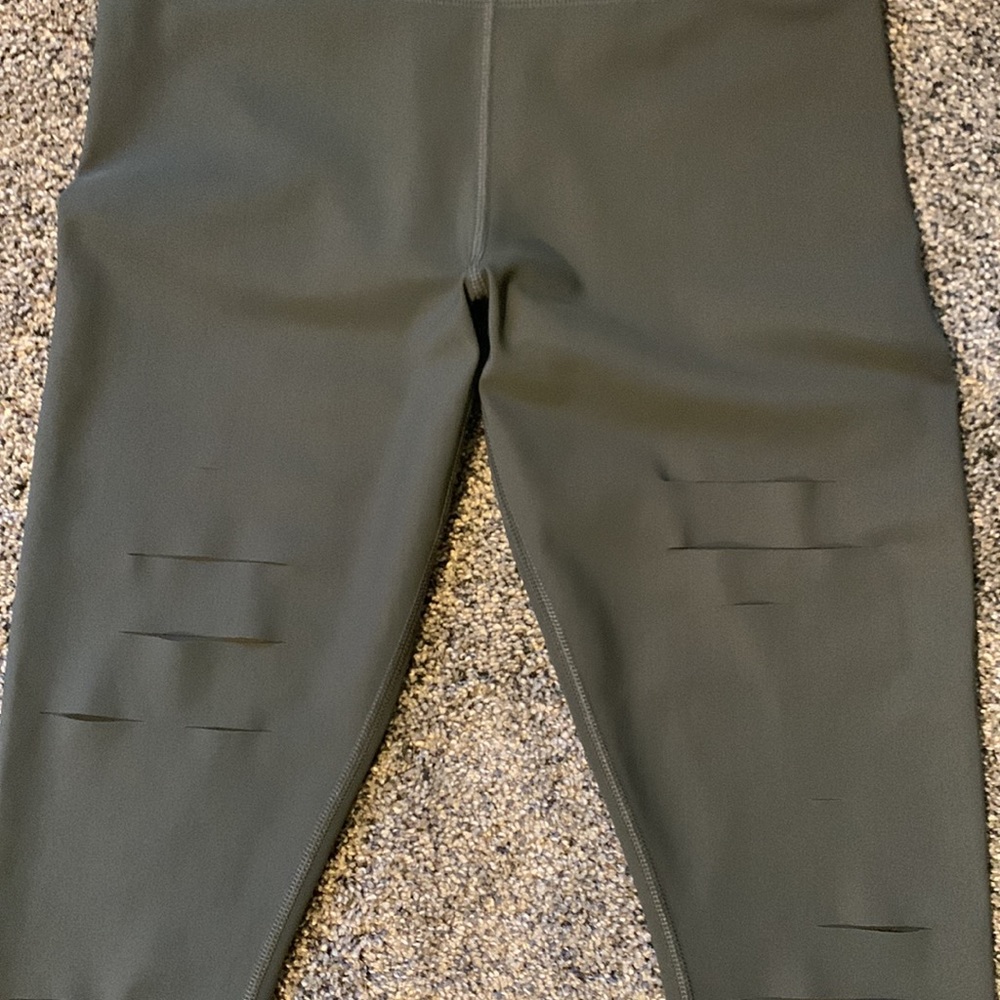 Alo high waisted ripped warrior legging in a size Medium